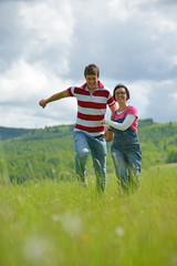 Portrait of romantic young couple smiling together outdoor