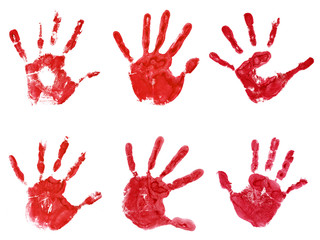 Conceptual red painted hand shape or print isolated on white