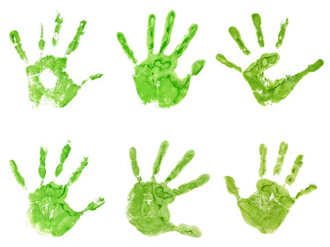 Conceptual green painted hand shape or print isolated on white