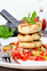 Delicious grilled burgers with vegetable salad for dinner
