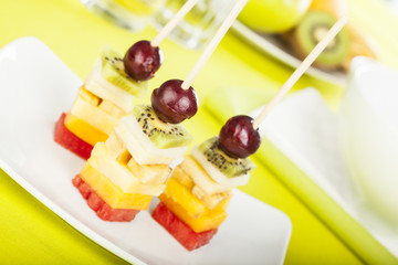 delicious fruit skewers served on a plate