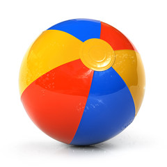 Colorful beach ball with water drops