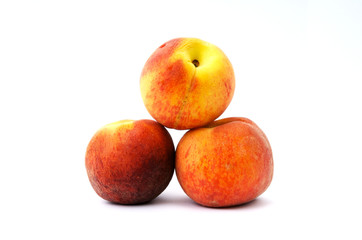 Fototapeta na wymiar Three peaches isolated on a white background