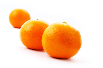 Three oranges isolated on a white baclground