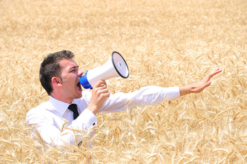 Business Man with loudspeaker