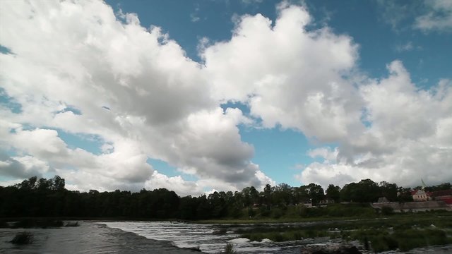 Clouda over river.
