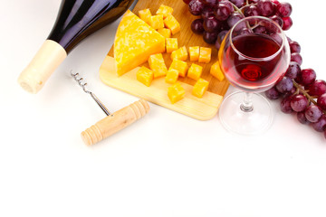 Bottle of great wine with wineglass and cheese isolated on