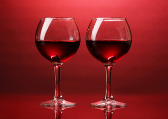 Wineglasses on red background