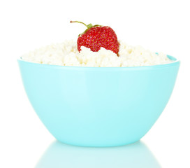 cottage cheese with strawberry in blue bowl isolated on white