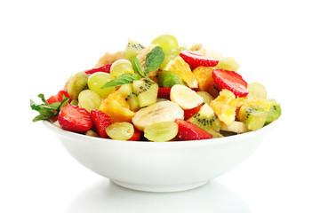 bowl with fresh fruits salad  isolated on white