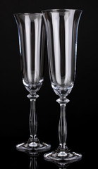 empty glasses for champagne isolated on black