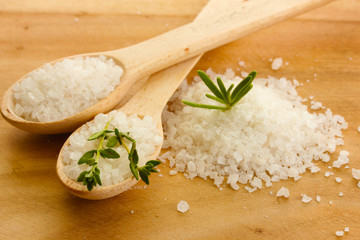salt in spoons with fresh  rosemary and thyme
