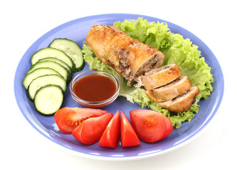 Tasty meat cutlet with garnish on plate isolated on white