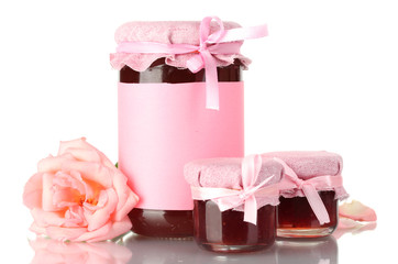 jars with rose jam and flower isolated on white