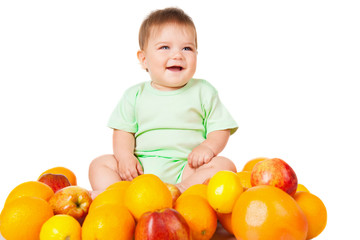 Fototapeta na wymiar Smiling baby sitting with fruit