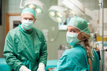 Fototapeta na wymiar Two surgeon wearing surgical equipment