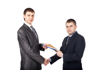 Handshake of business partners, when signing documents isolated