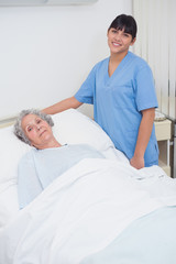 Fototapeta premium Nurse standing next to a patient