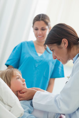 Doctor auscultating a child