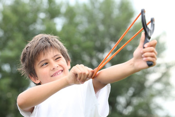 Boy with slingshot