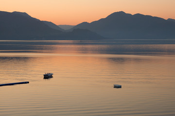 boats in the sea on sunrise