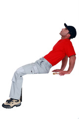 A male painter looking at the sky.