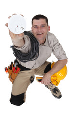 Electrician with a smoke alarm