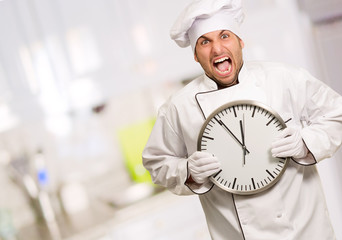 Chef Holding A Big Clock