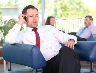 Young business man enjoying a conversation over cellphone