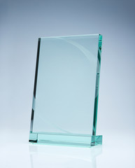 Photo of blank glass award plate with copy space