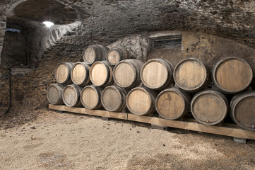 wine cellar with kegs in a row