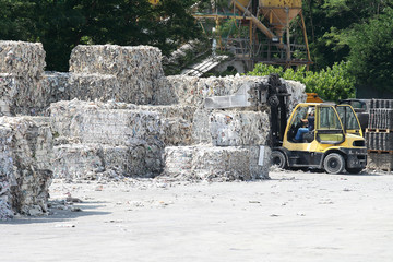 fork lift and paper bales