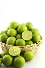 Fresh lemon in wood basket on white background