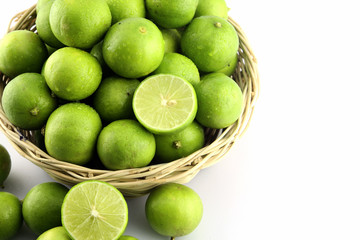 Fresh lemon in wood basket on white background