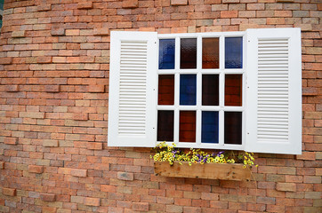 Brick wall with colorful staingrass windows