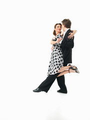 passionate dancing couple on white background