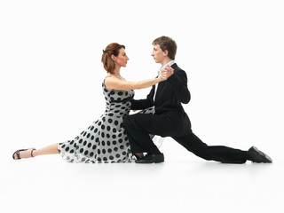 passionate dancing couple on white background