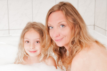 woman and girl enjoying a bath