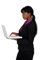 attractive black woman using laptop isolated on white
