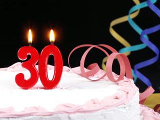 Birthday cake with red candles showing Nr. 30