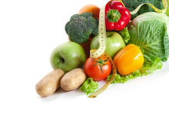 Group of fresh vegetables with a measuring tape, isolated