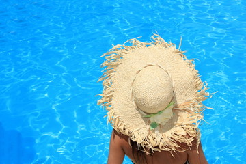Young woman enjoying a swimming pool