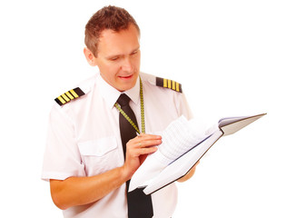 Airline pilot filling in papers © Monika Wisniewska
