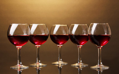 Wineglasses on brown background