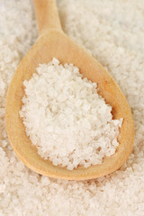 Sea salt with wooden spoon close-up
