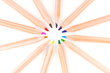 Fototapeta premium Colorful wooden pencils arranged in a circular pattern, creative art supplies for drawing and education