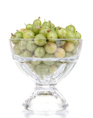 Green gooseberry in glass isolated on white