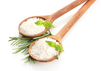 salt in spoons with fresh basil, thyme and rosemary isolated