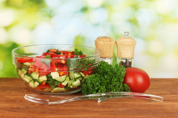Fresh salad on green background