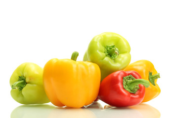 fresh yellow, red and green bell peppers isolated on white